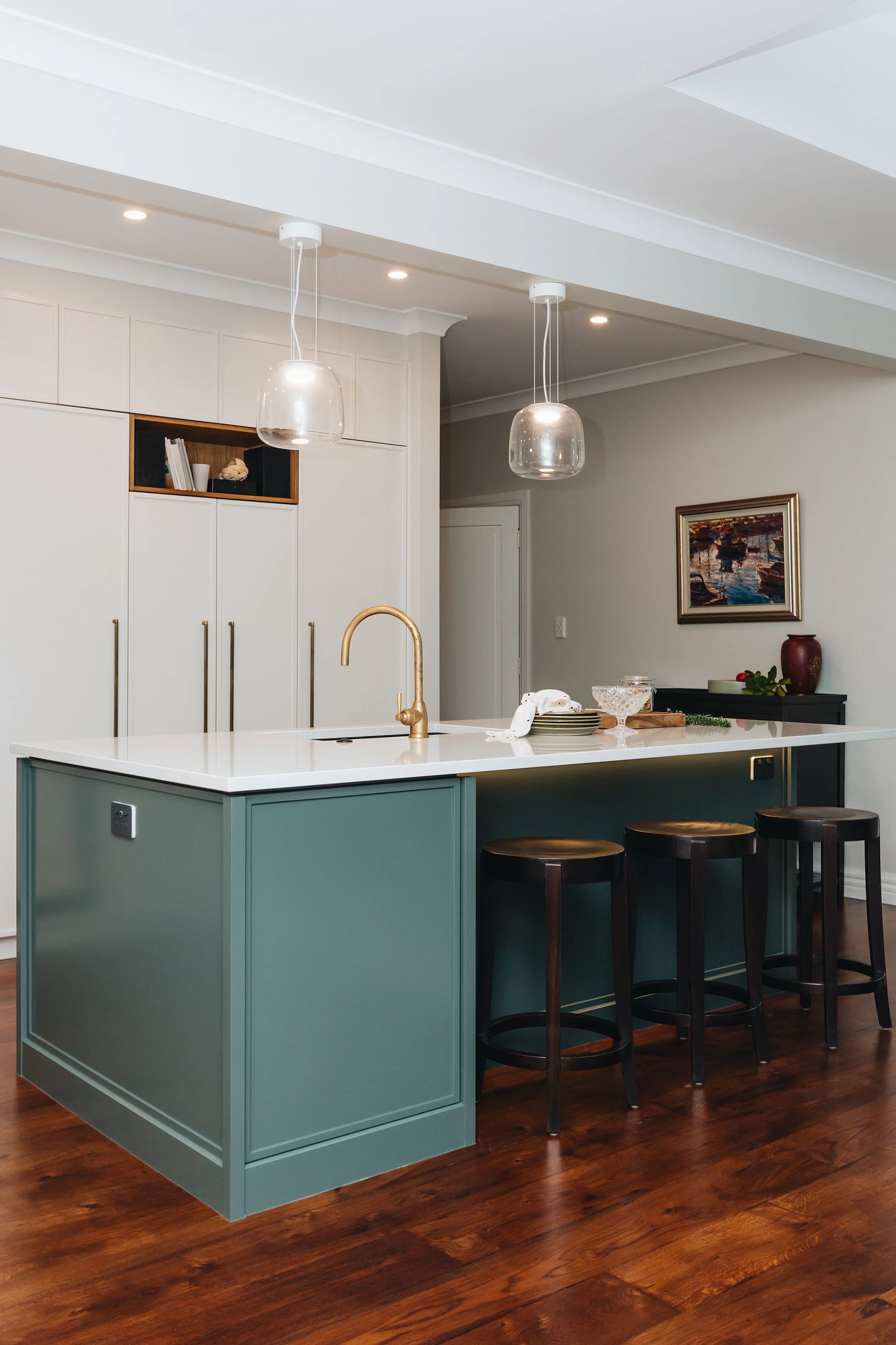 dark-teal-kitchen-bar-island-white-countertop.jpg