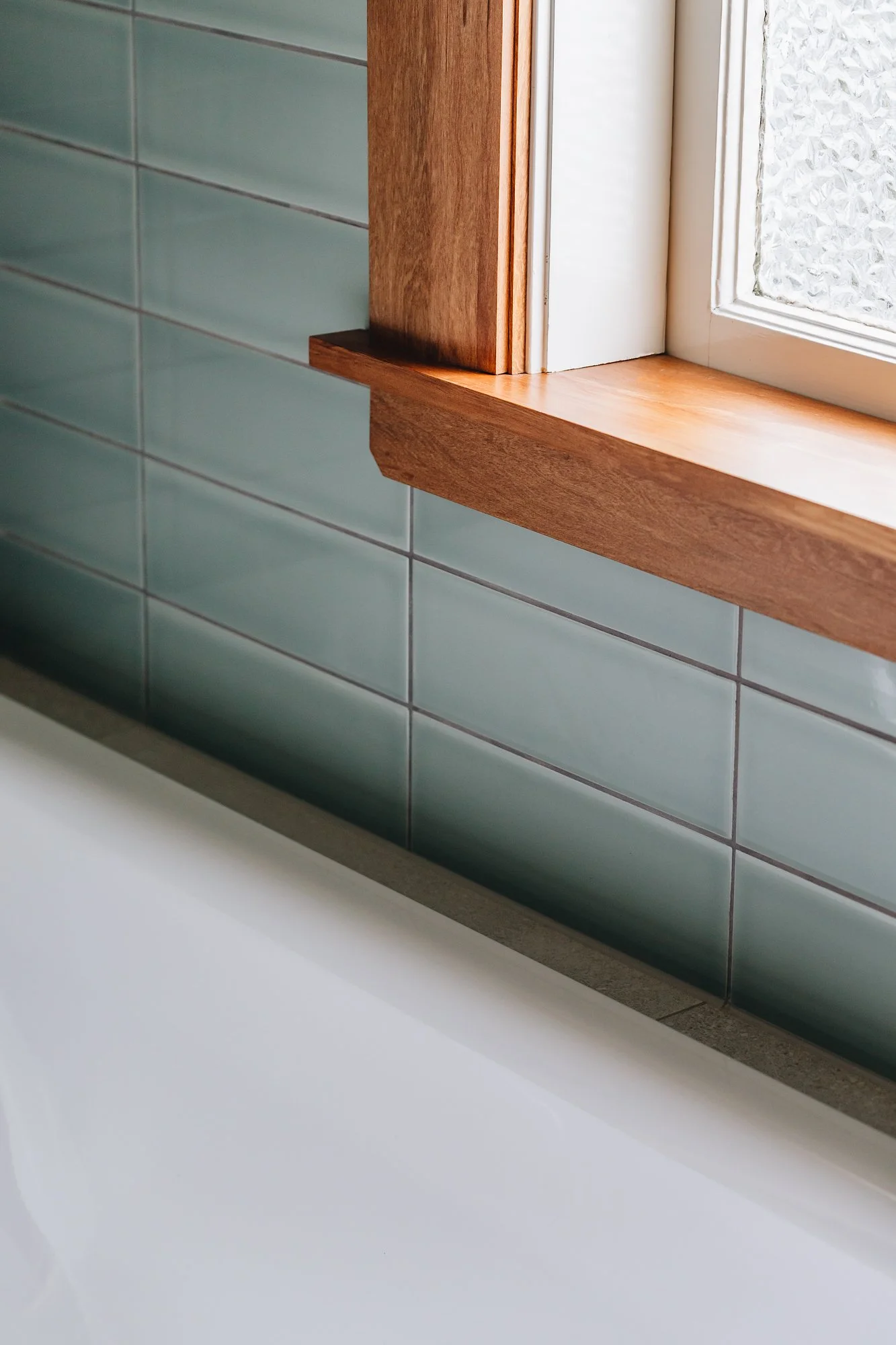 glossy-teal-subway-tiles-bath-detail.jpg