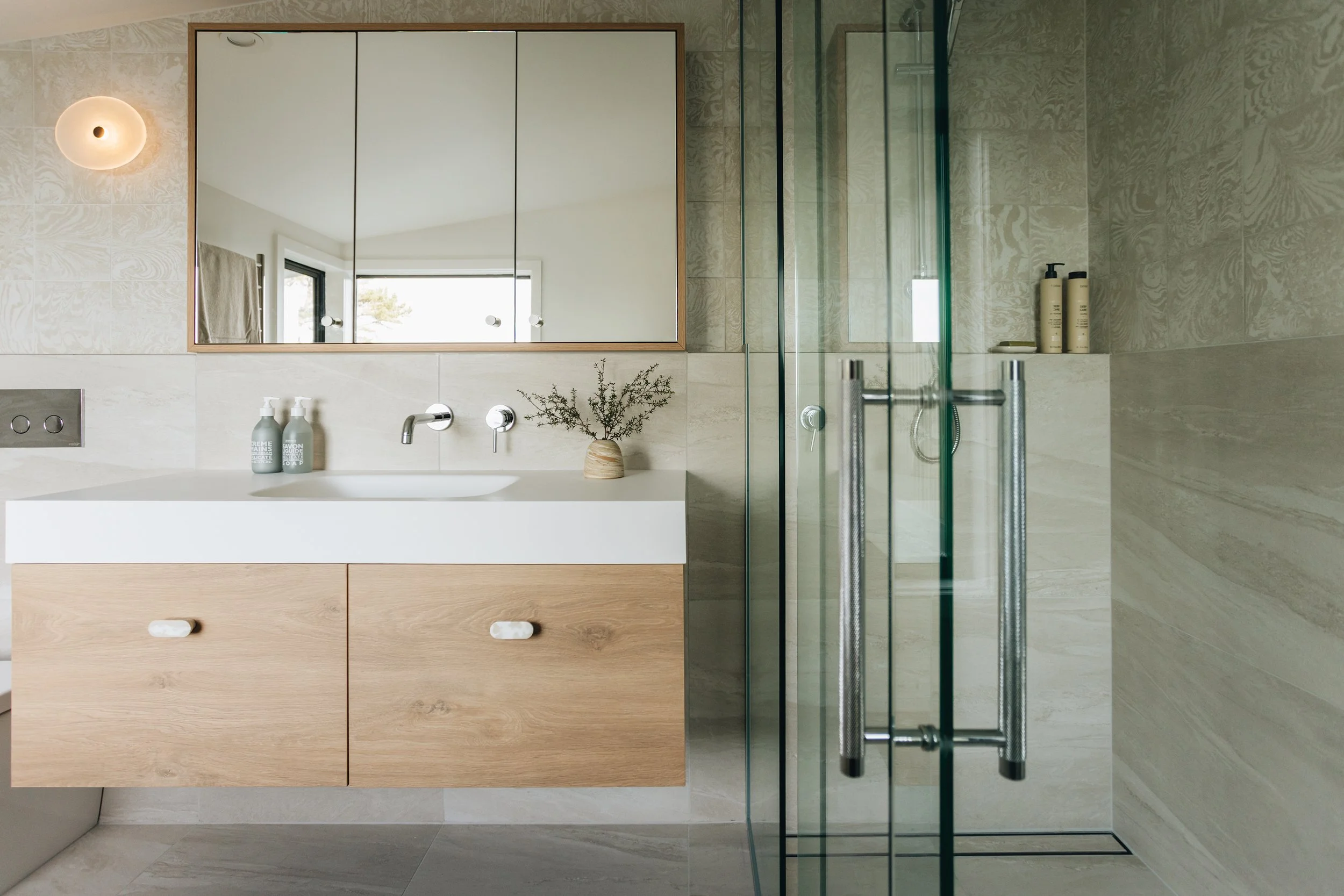 beige-tiled-ensuite-modern-bathroom-fixings.jpg