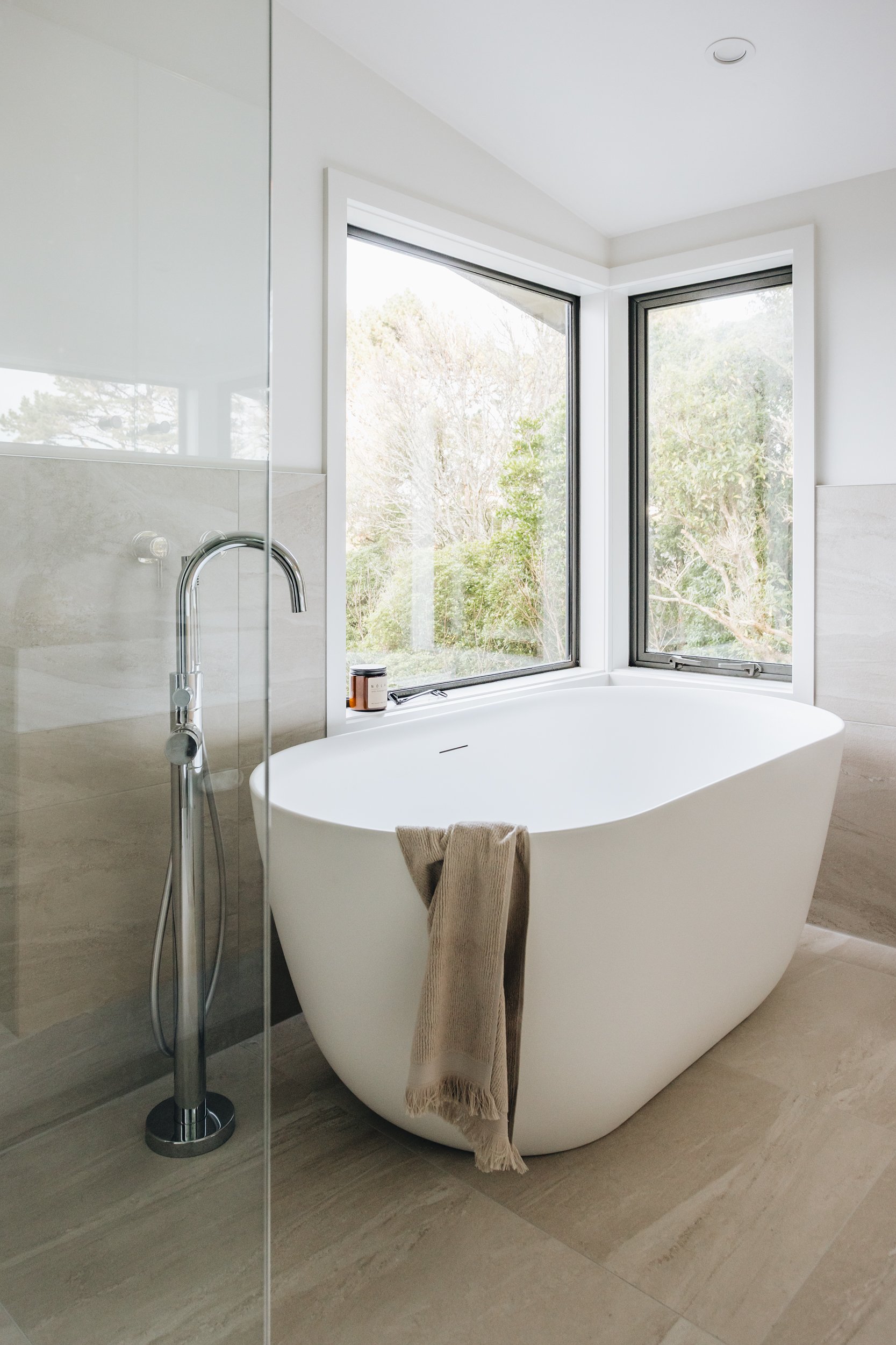  Modern ensuite bathroom with Wellington harbour views and freestanding bath designed by Kerryn Dunshea Interior Design 