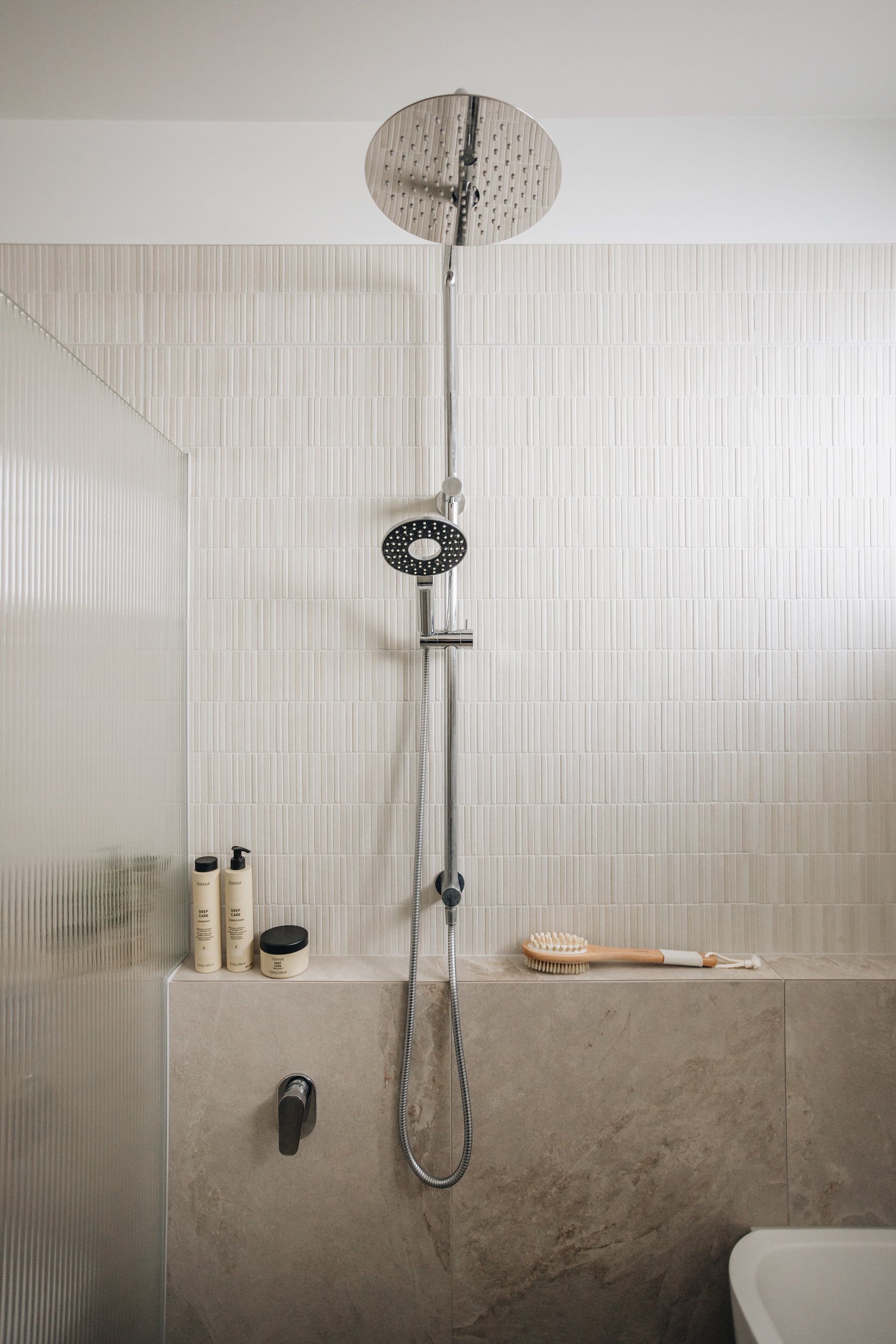 mini-porcelain-wall-tile-chrome-shower-hardware.jpg