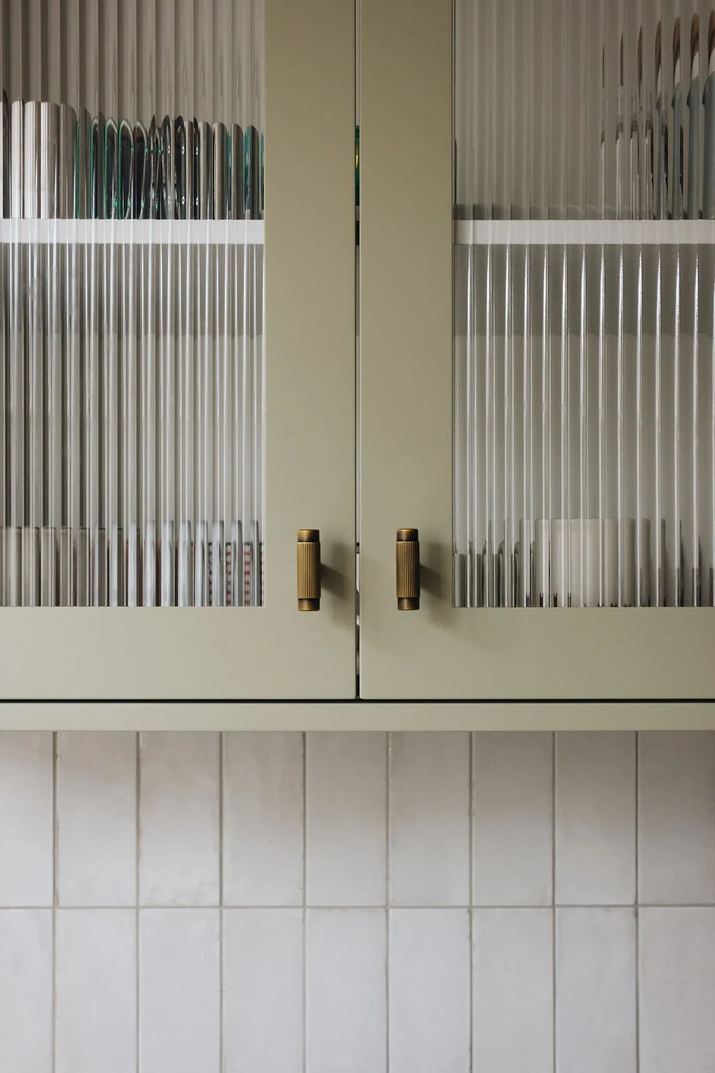 green-kitchen-cabinetry-antique-brass-handles.jpg