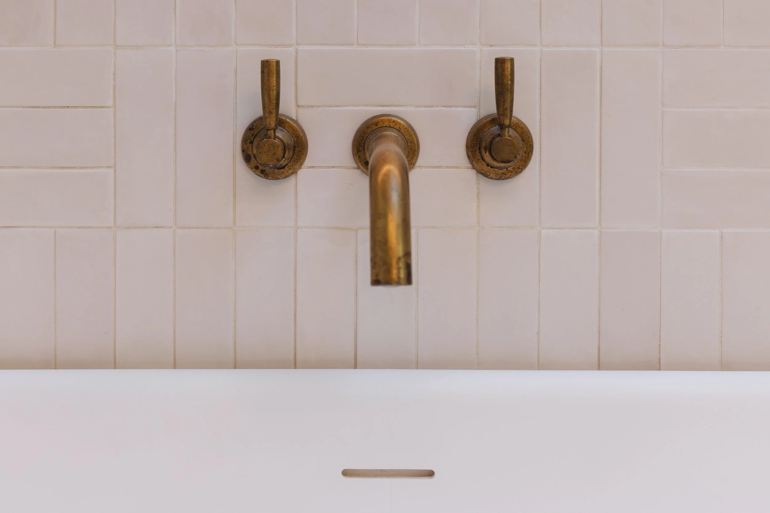antique-brass-tapware-in-rustic-bathroom.jpg