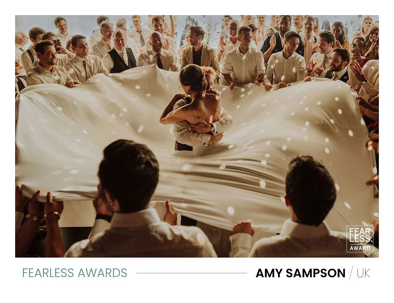 Over the moon to win one of the very highly coveted @fearlessphotographerscom awards for this image of wonderful Talia and Alex @hamswellhouse - wrapped up together inside the sheet (which looked like Talia had an incredibly large dress skirt) during