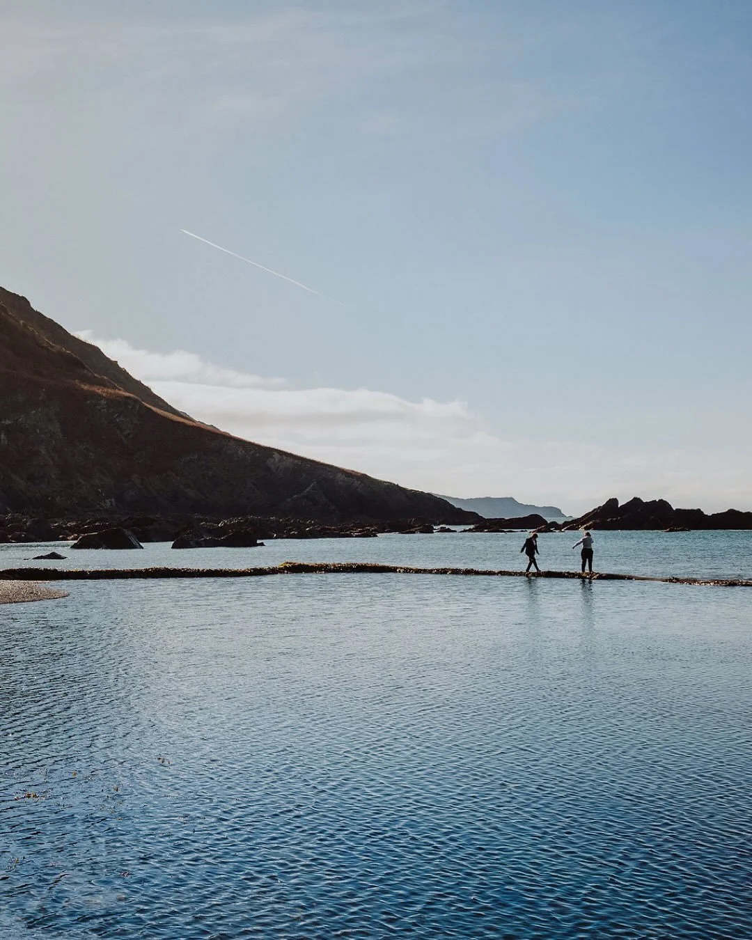 There&rsquo;s something of an autumnal draw to @tunnelsbeaches &hellip; the last few Octobers I&rsquo;ve found myself photographing the most incredible weddings there; a time of year when the ethereal fingers of low light diffuse over high cliff tops