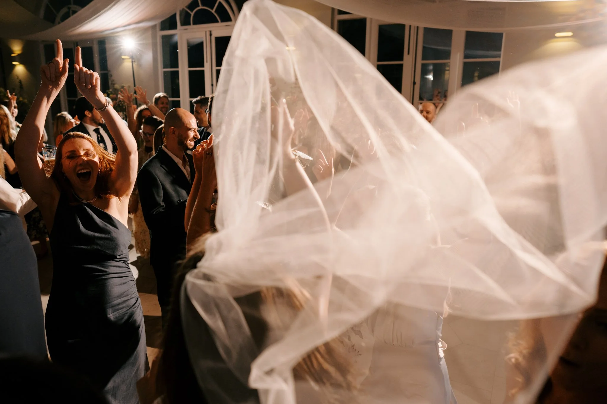 Friends party at a wedding at Deer Park in Devon captured by Amy Sampson Photography
