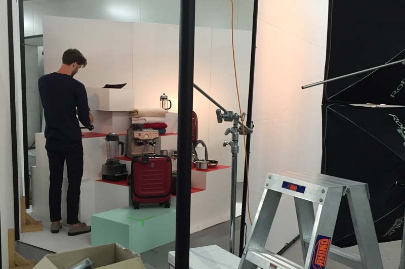 Setting up the lighting, cameras, plinths and products for the photoshoot.