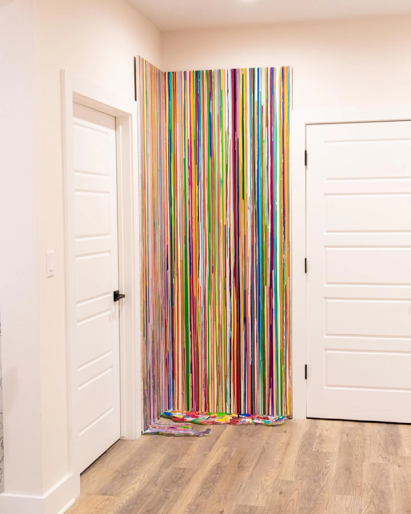 My most recent, large bodied work blends wall art and floor art together! 
Photo 2 shows the paint &ldquo;puddle&rdquo; on the floor.