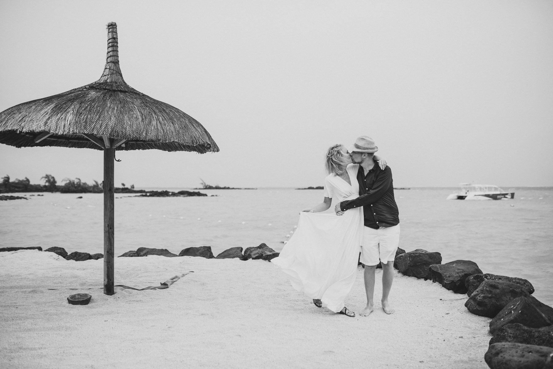 Copy of Sita Kelly | Mauritius Honeymoon Photographer | Couple kissing in wind in front of the sea