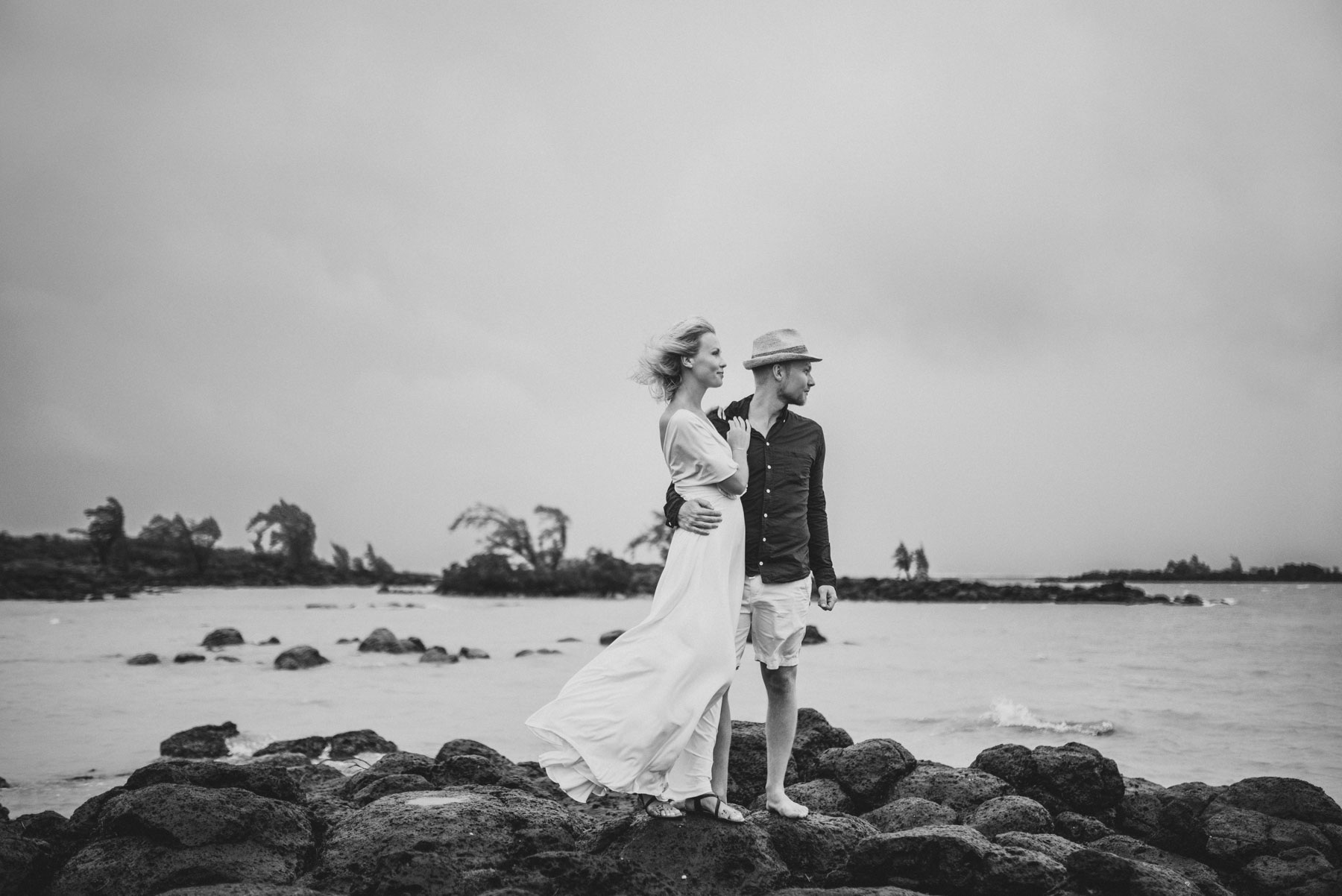 Copy of Sita Kelly | Mauritius Honeymoon Photographer | Couple kissing standing on rocks looking at sea