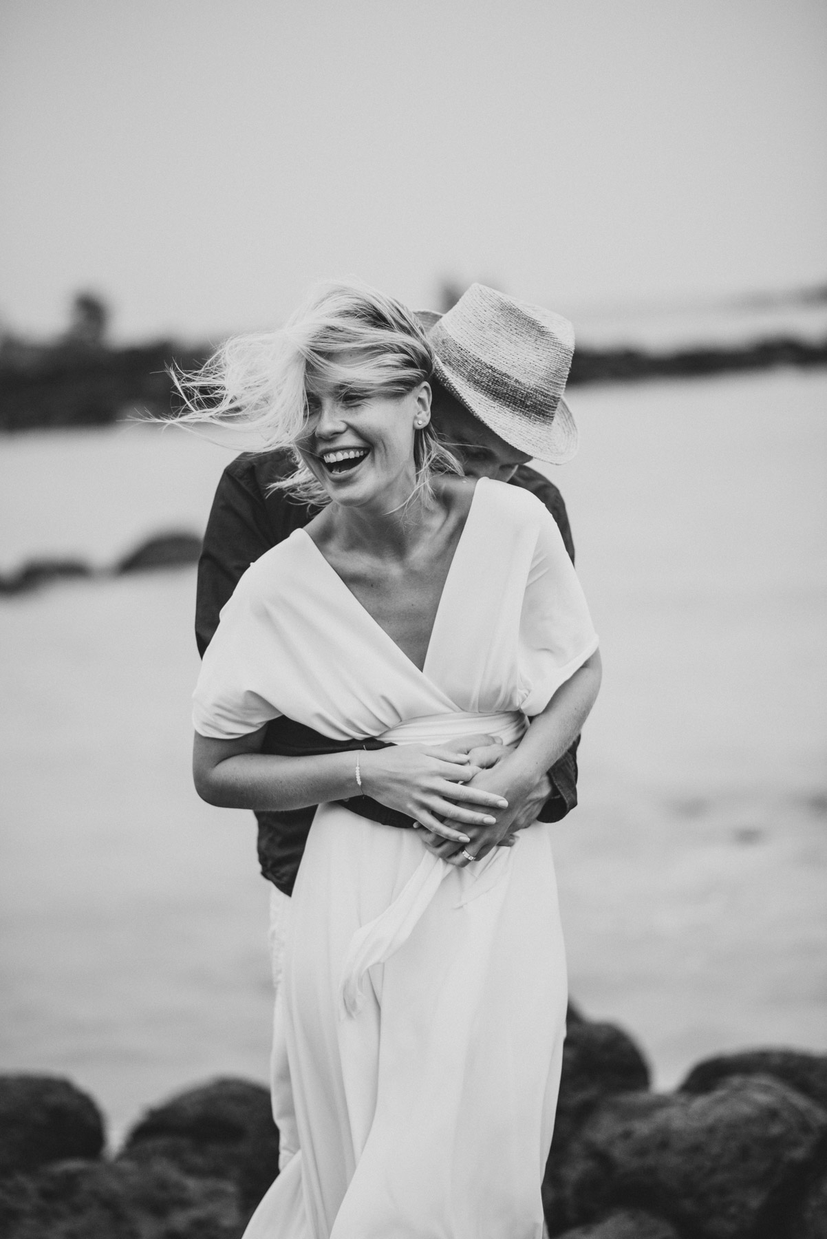 Copy of Sita Kelly | Mauritius Honeymoon Photographer | man kissing woman's neck, woman laughing