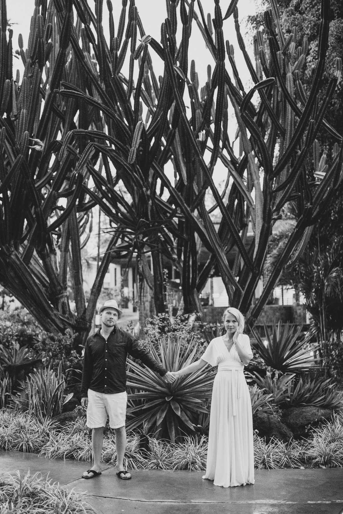 Copy of Sita Kelly | Mauritius Honeymoon Photographer | Coupleholding hands in front of a cactus