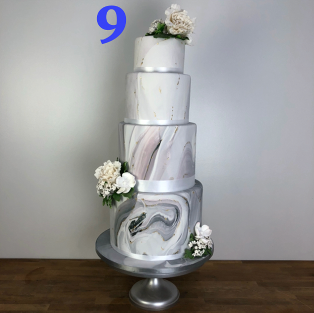 Marble cakes were all the rage this year and this one is our favorite! Classic yet modern and trendy, this cake brings together different elements organically into its design. It has the hard look of marble with a soft touch of flowers. Small hints of gold give it an added sparkle!