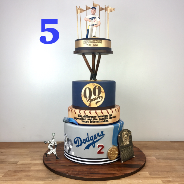 It was an honor to make a cake for the living legend that is Tommy Lasorda. The iconic coach got to see his beloved LA Dodgers go all the way to the world series this year! What we loved about this cake was all the easter eggs that were hidden in the design. Did you know Tommy Lasorda has a comet named after him? We got to learn a lot about the legendary coach and we included it all! His figure is modeled after his portrait in the Smithsonian and the story of how he met his wife is on there too. This cake was extra special since we made it watching the Dodgers make their way to the world series.