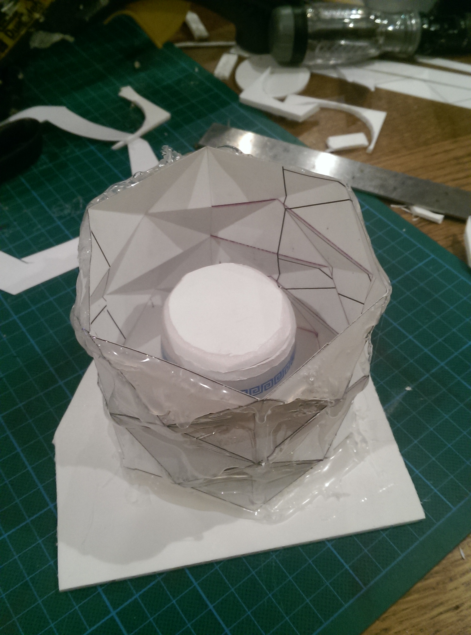 ⬆ - Thick card was folded into the desired pattern and reinforced with hot glue. A plastic pot with draft creates the hollow in the pot.