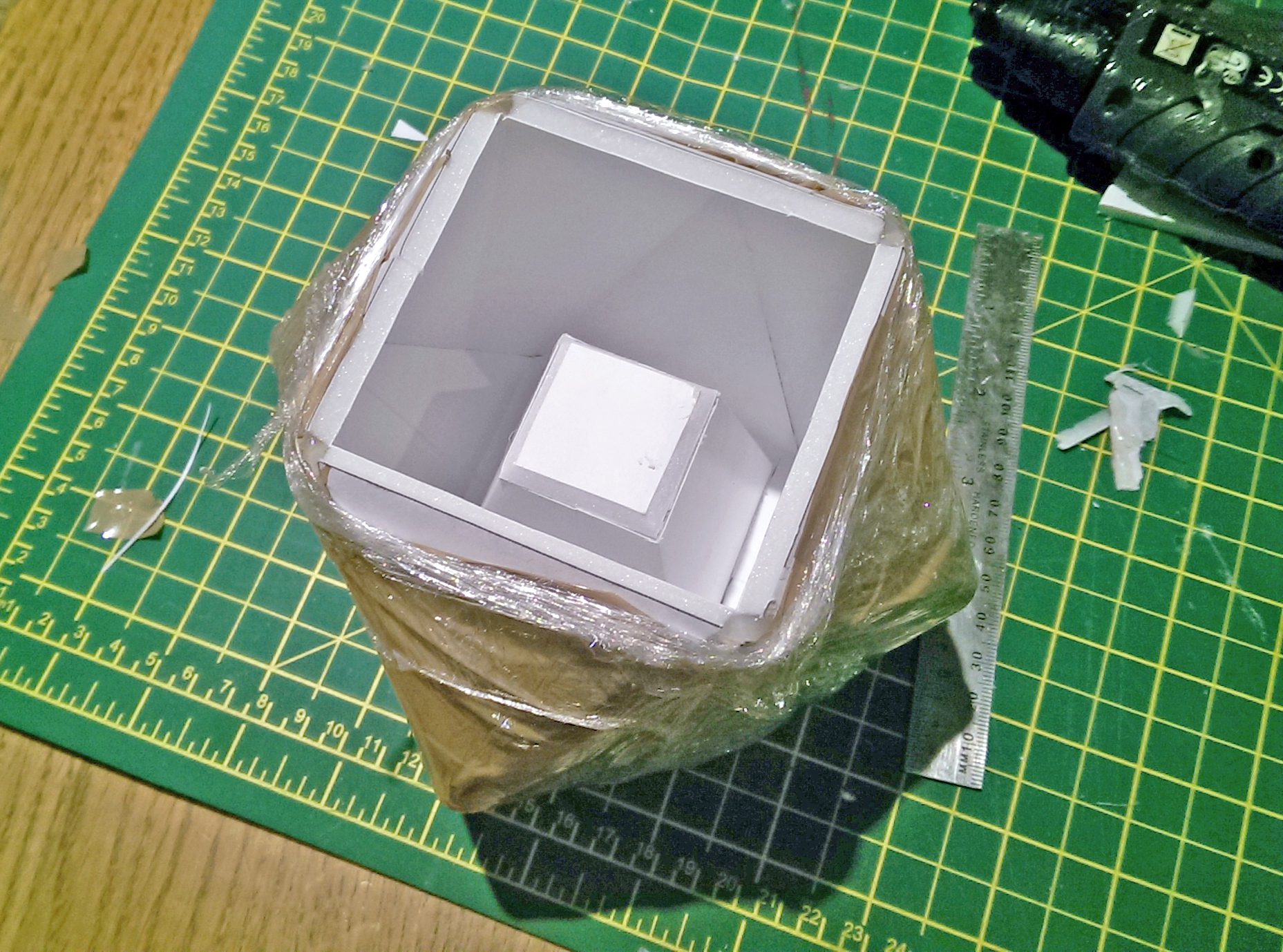 ⬆ - A foam core mould was wrapped in cling film to decrease the evaporation of water from the mould whilst the concrete was curing.