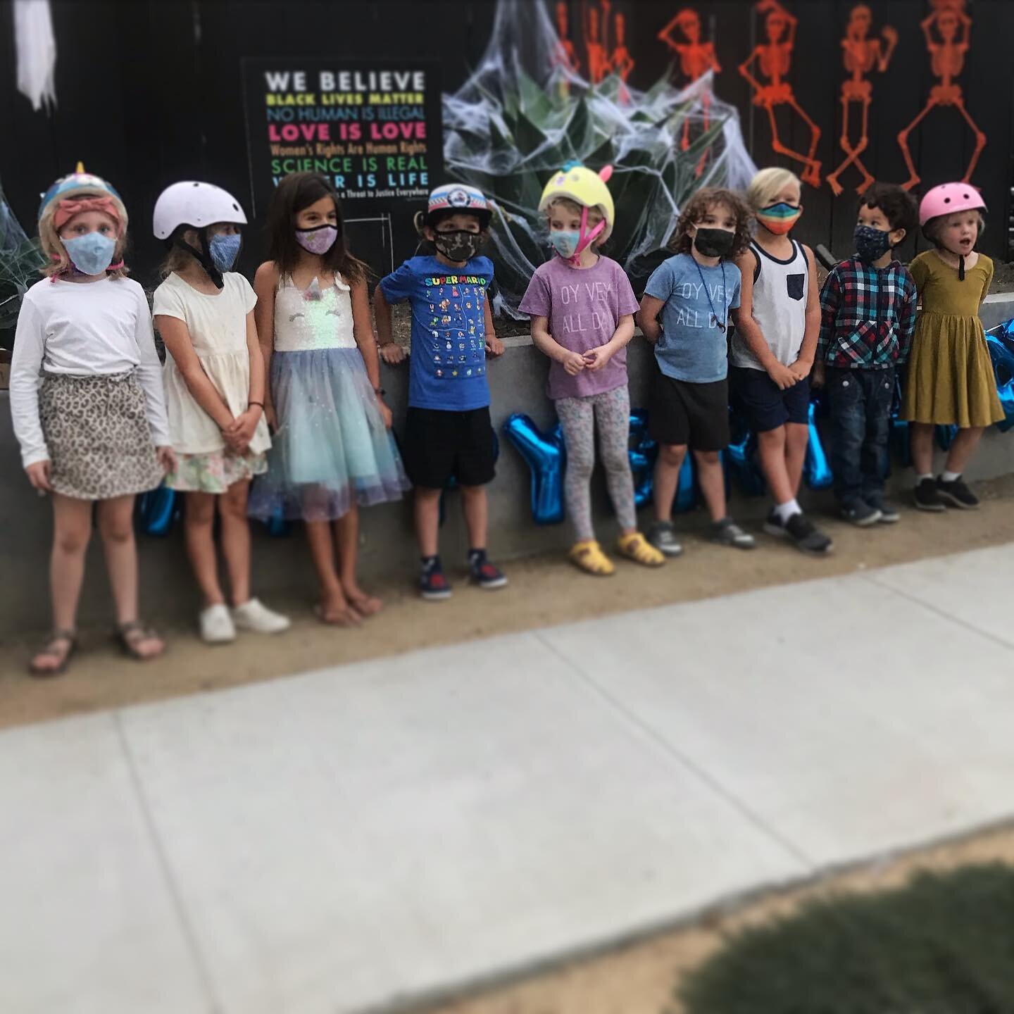 A whole bunch of five-year-olds from our neighborhood, giving some impromptu birthday love to little Rennie (rainbow mask), one of my all-time favorite kids. This year has been so incredibly weird for so many  children &mdash; and they never cease to impress me. &hearts;️