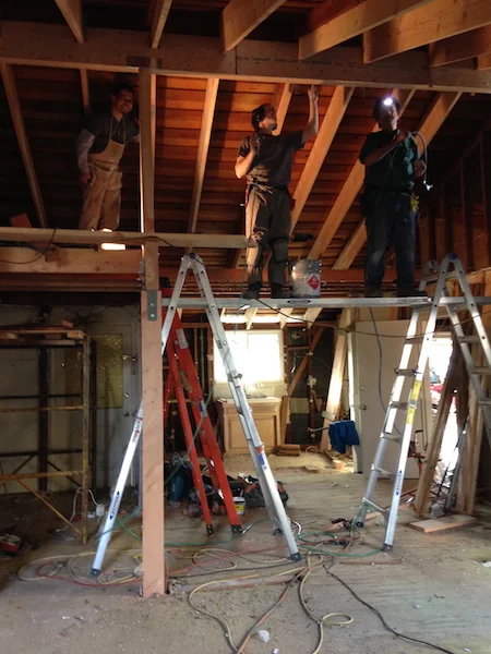 Pneumatic palm nailers helped us get the requisite nails into the brackets in tight quarters. Top half of this photo: relative order. The bottom: utter chaos.