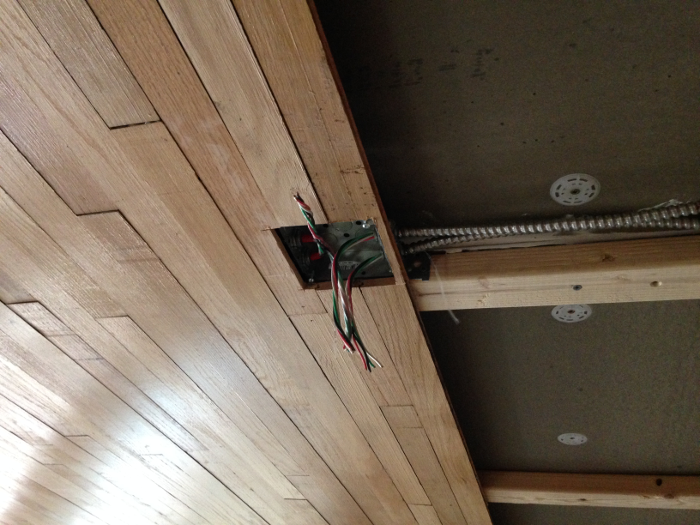 Detail of cut-out for electrical junction box for suspended lighting fixtures. Note gaps and depth variation in the pieces.