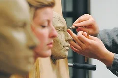 Georgia Rhodes | Jackson Citizen Patriot | Kathryn Snyder sits still while sculptor Brandon Irish works on a clay sculpture.