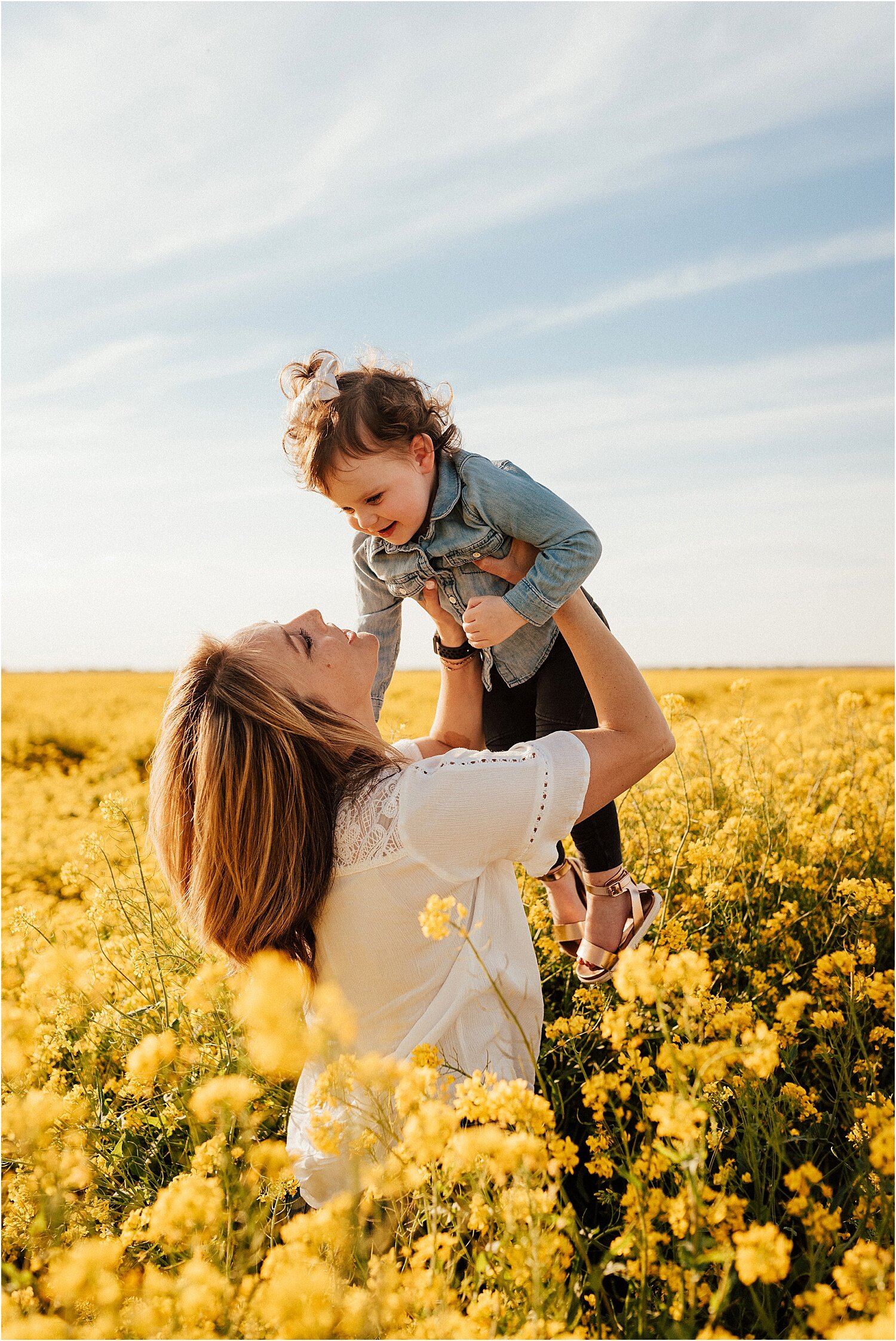 spring field of yellow flowers family session13.jpg