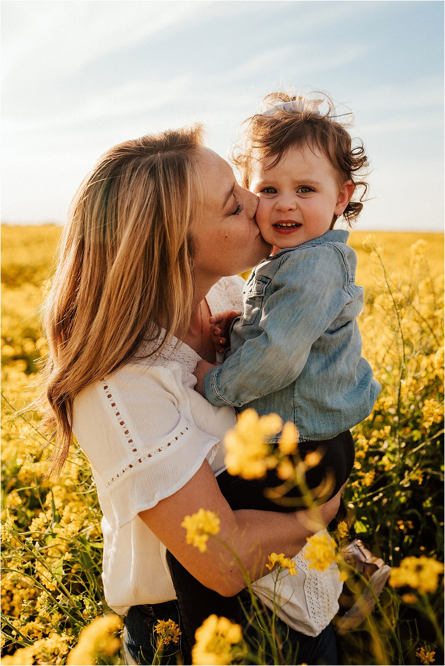 spring field of yellow flowers family session15.jpg