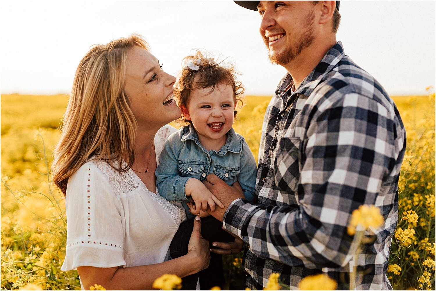 spring field of yellow flowers family session18.jpg