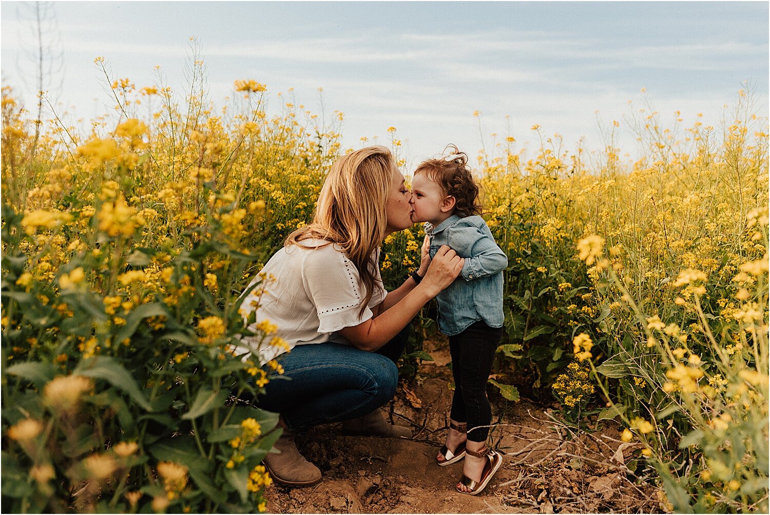 spring field of yellow flowers family session27.jpg