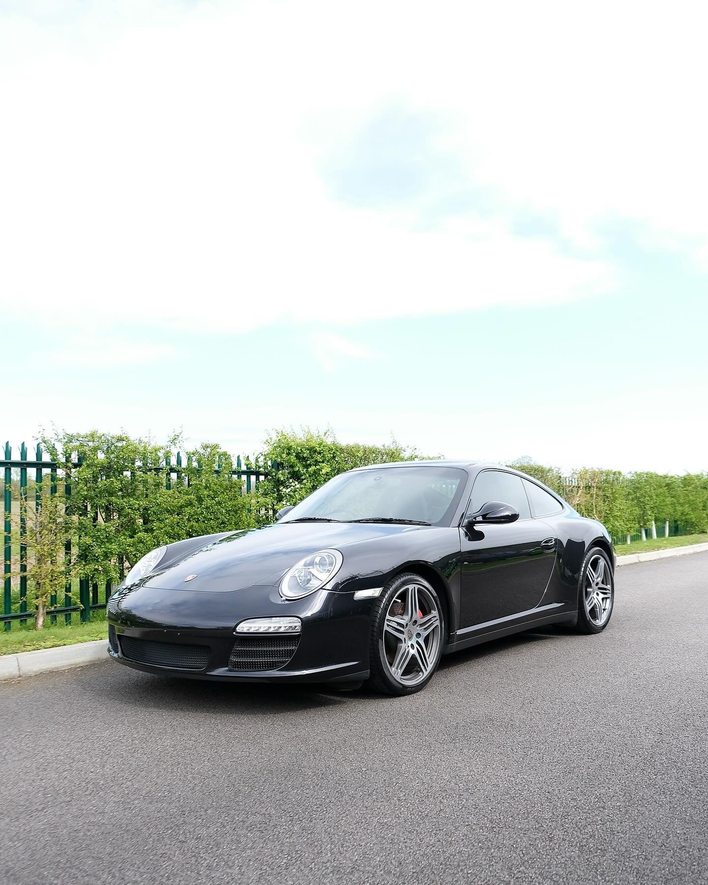 Basalt black Porsche 911 (997) Carrera 4 S following our extended front PPF install using Suntek Reaction PPF, Suntek Ceramic Window tints installed and wheel refurbishment. A low mileage well cared for example having some subtle enhancements and fun