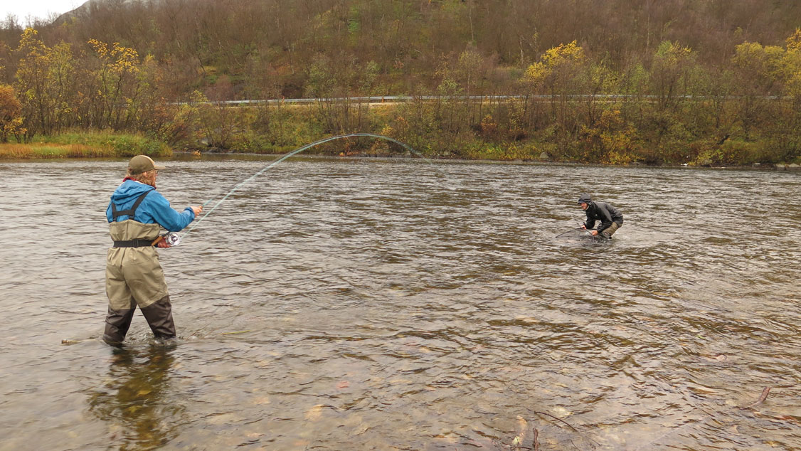 Anglers landing an Atlantic salmon. Robert Lennox photo.