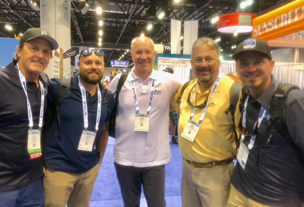 From left: KWF Ambassadors Captain Tony Digulian and photographer Adrian Gray grin along side Neil Horton and Eric Combast of IGFA. Keepemwet founder Bryan Huskey on the end.