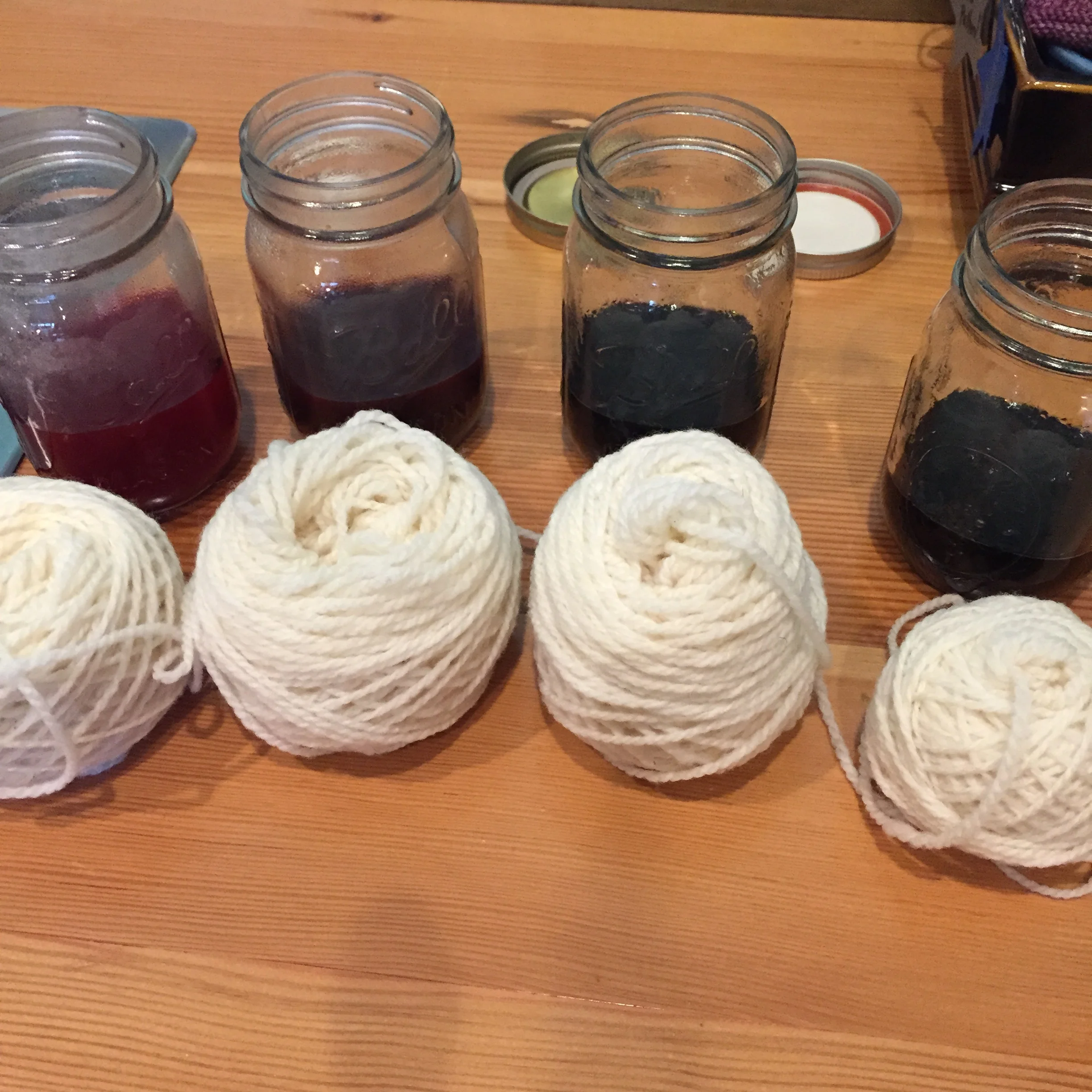 I boiled some water in my tea kettle and added it to the Kool-Aid jars. I thought I had put in enough to cover the yarn and then stirred it. 