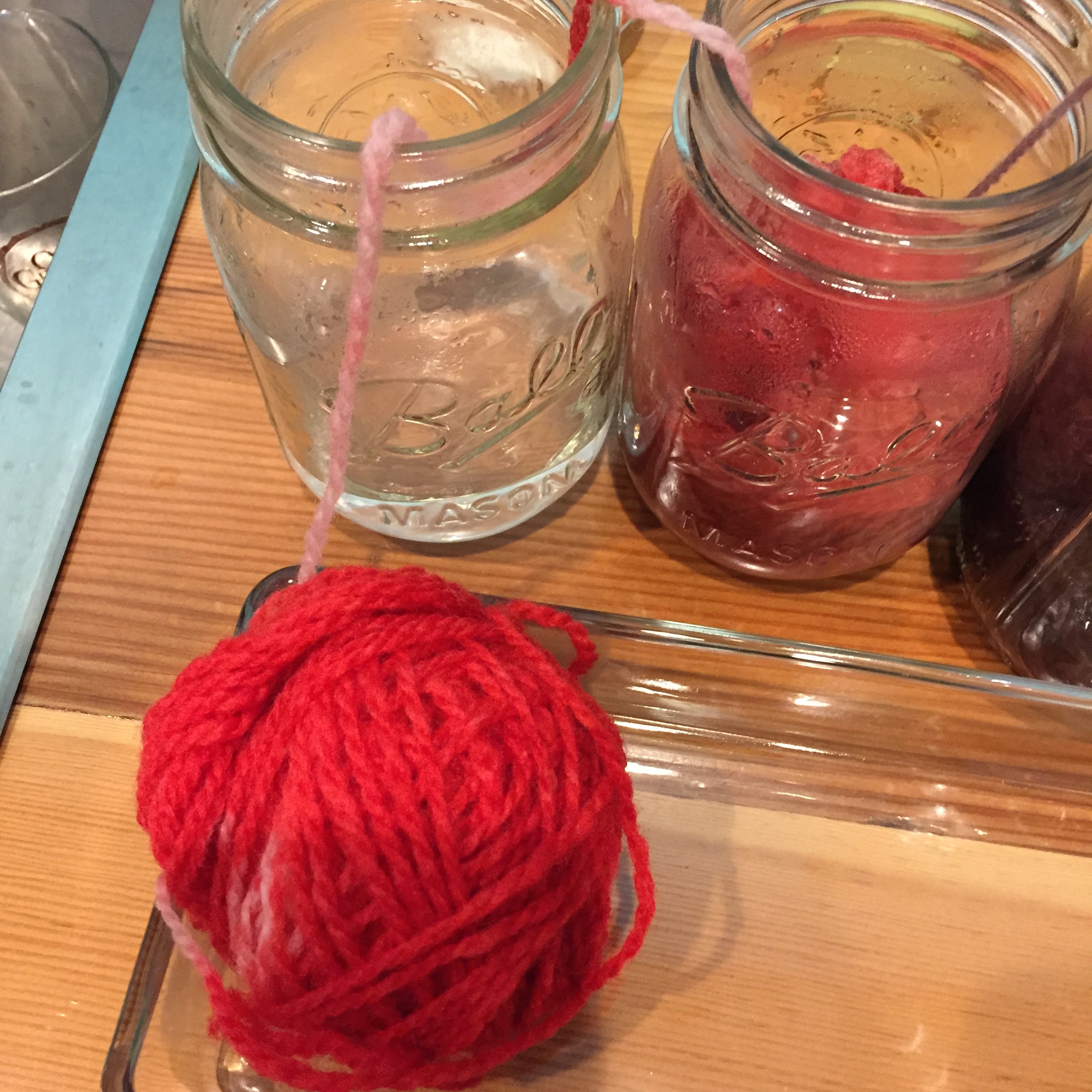 I pulled the balls of yarn out of the water as soon as it was cool enough to touch. See how the water is clear? Pretty crazy right?! 
