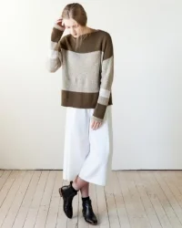 Symmetrically aligned blocks of solid and marled colors help create a canvas of this oversized pullover. Mostly striped and worked with a hint of intarsia to merge the bigger blocks, the pullover is accented with folded hems and matching neckline. Download from Ravelry Here