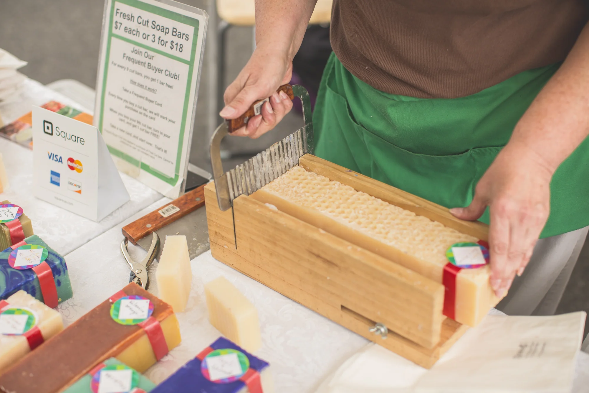 Once the soap is ready for market, it must be sliced into loaves and then cut into bars!