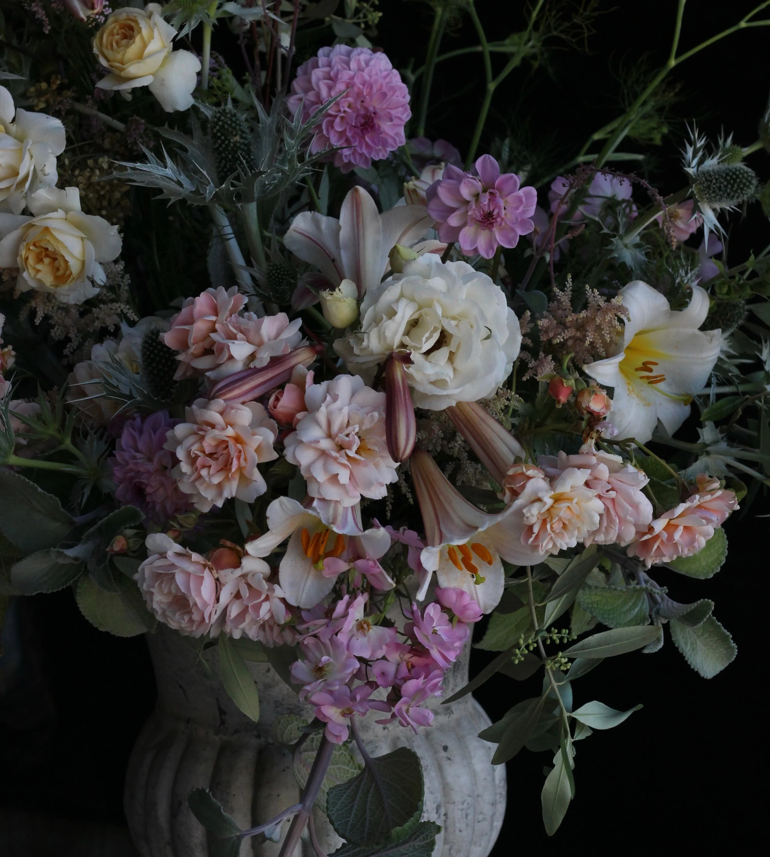 The petite roses here are 'Felicia' with Lilium regale.