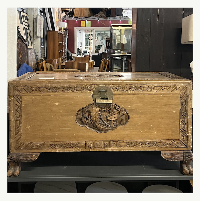 Antique carved wood chest with brass medallion hardware and claw feet at Poor Honey's Oakland — ready for furniture restoration or refinishing