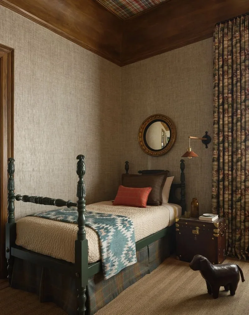 Vintage twin bed lacquered in custom green by Revitaliste with plaid ceiling, equestrian drapery, and vintage trunk nightstand in Jeffrey Neve Interior Design's Double Standard bedroom at the 2026 San Francisco Decorator Showcase