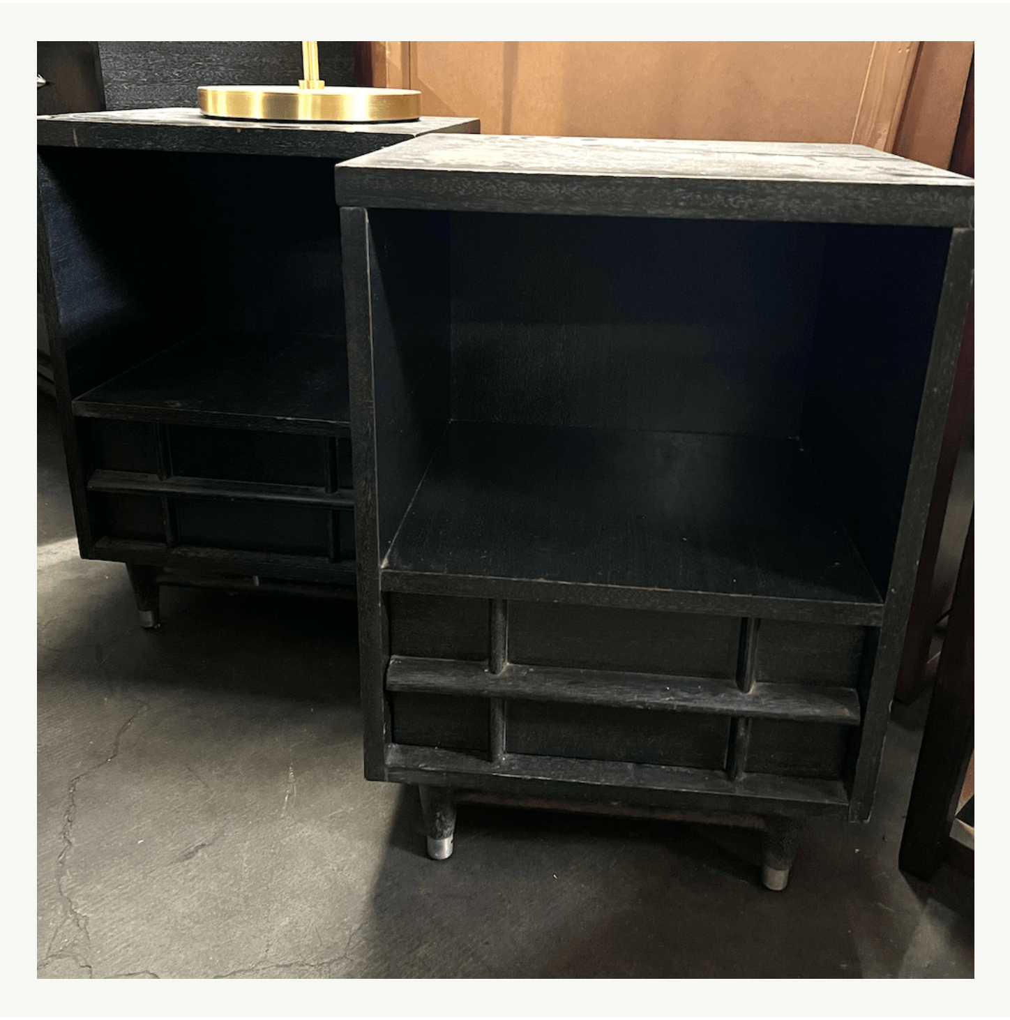 Pair of 1950s ebonized nightstands with geometric stepped base at Poor Honey's Oakland — architectural vintage finds ready for refinishing