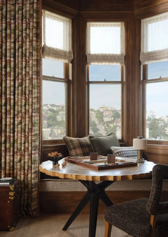 Bay window seating area with backgammon board and San Francisco skyline views in Jeffrey Neve Interior Design's Double Standard bedroom at the 2026 San Francisco Decorator Showcase