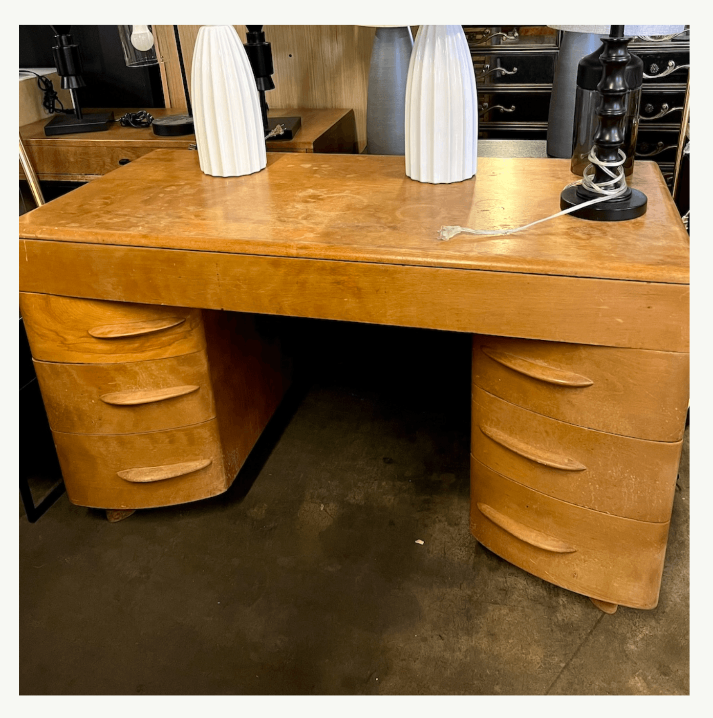 Heywood Wakefield blonde wood executive desk and chair at Poor Honey's Oakland — ideal for furniture refinishing and restoration