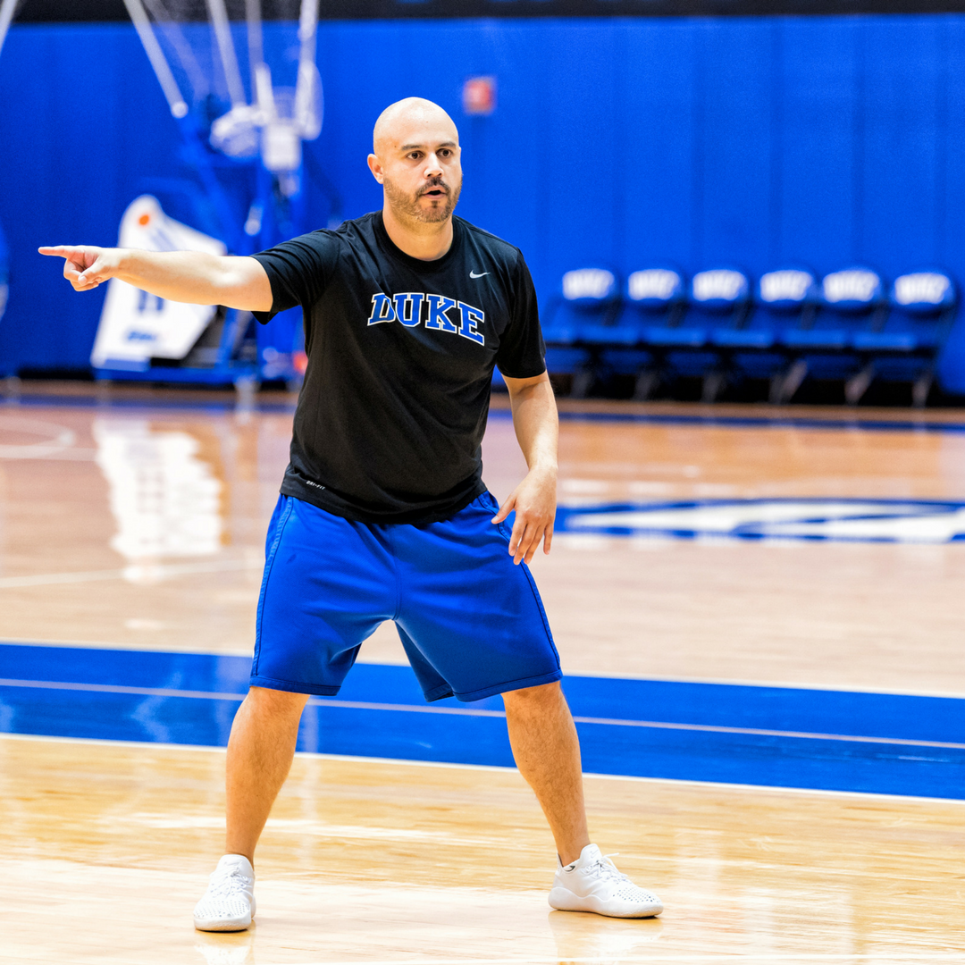 Coach H coaching on the basketball court at Duke