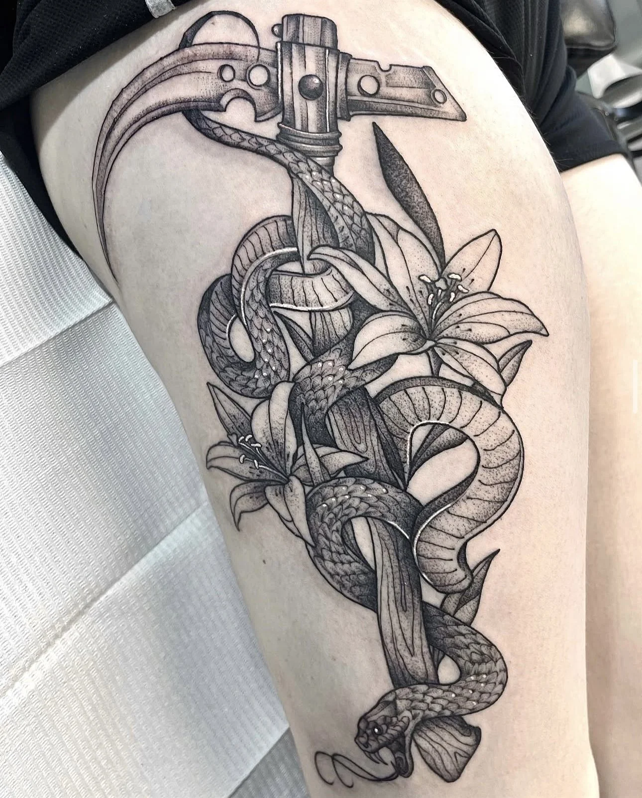 snake scythe and lily tattoo by st louis artist ayanah