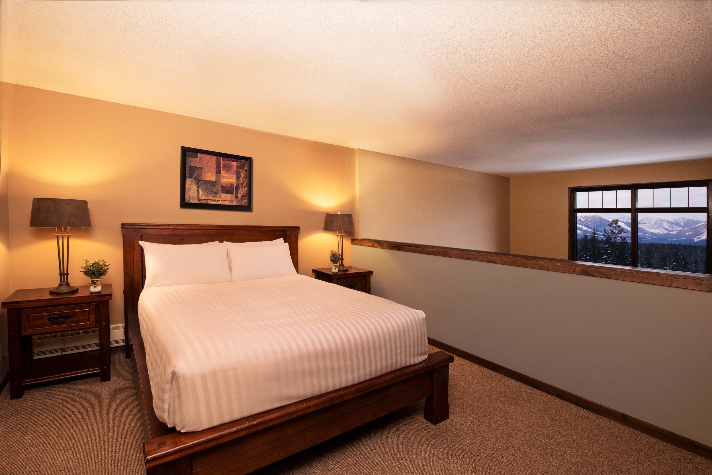 Cozy Loft Bedroom in Glacier Mountaineer Lodge | One-Bedroom Loft Suite