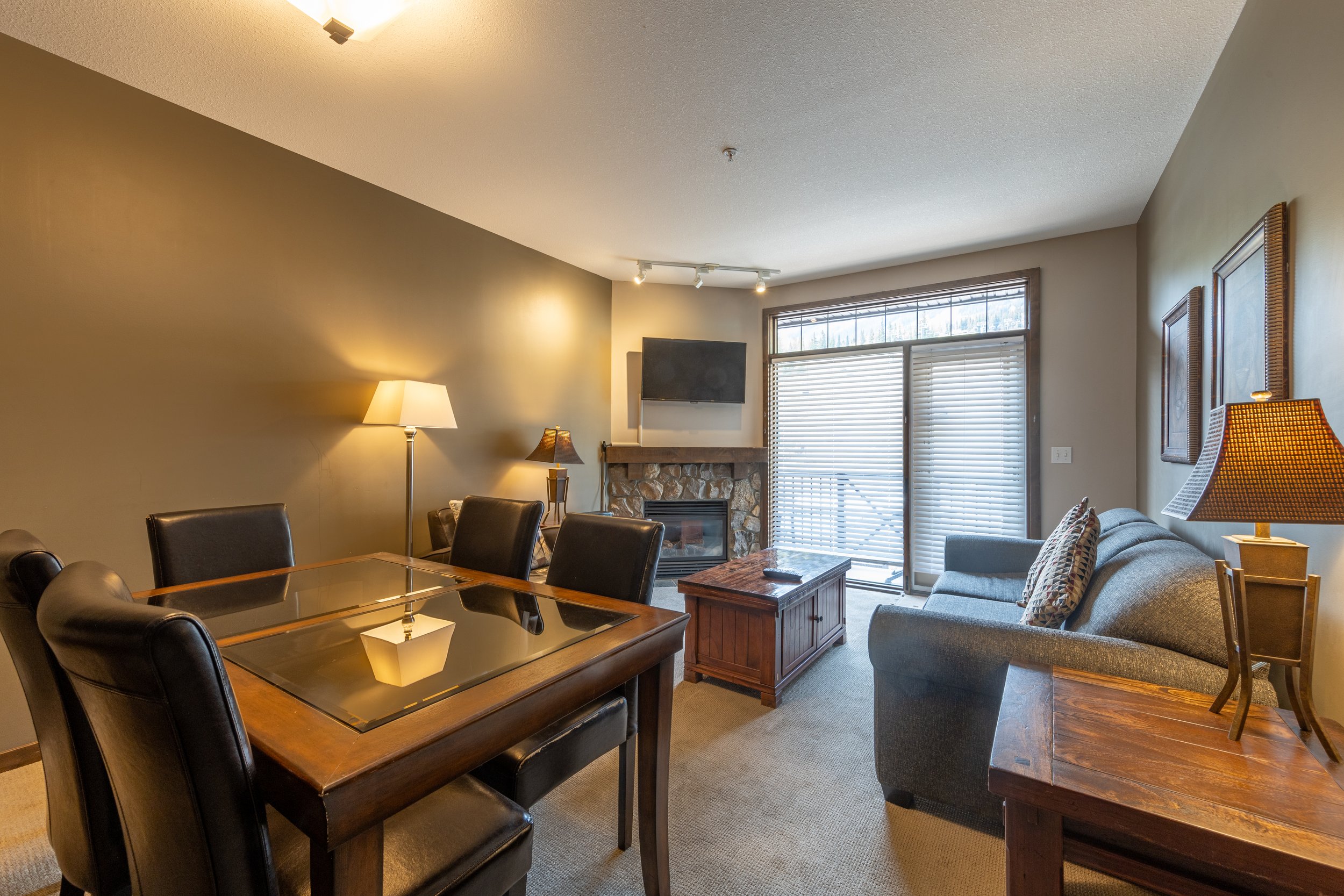 Spacious Living Room and Dining Area in Glacier Mountaineer Lodge | One-Bedroom Loft Suite