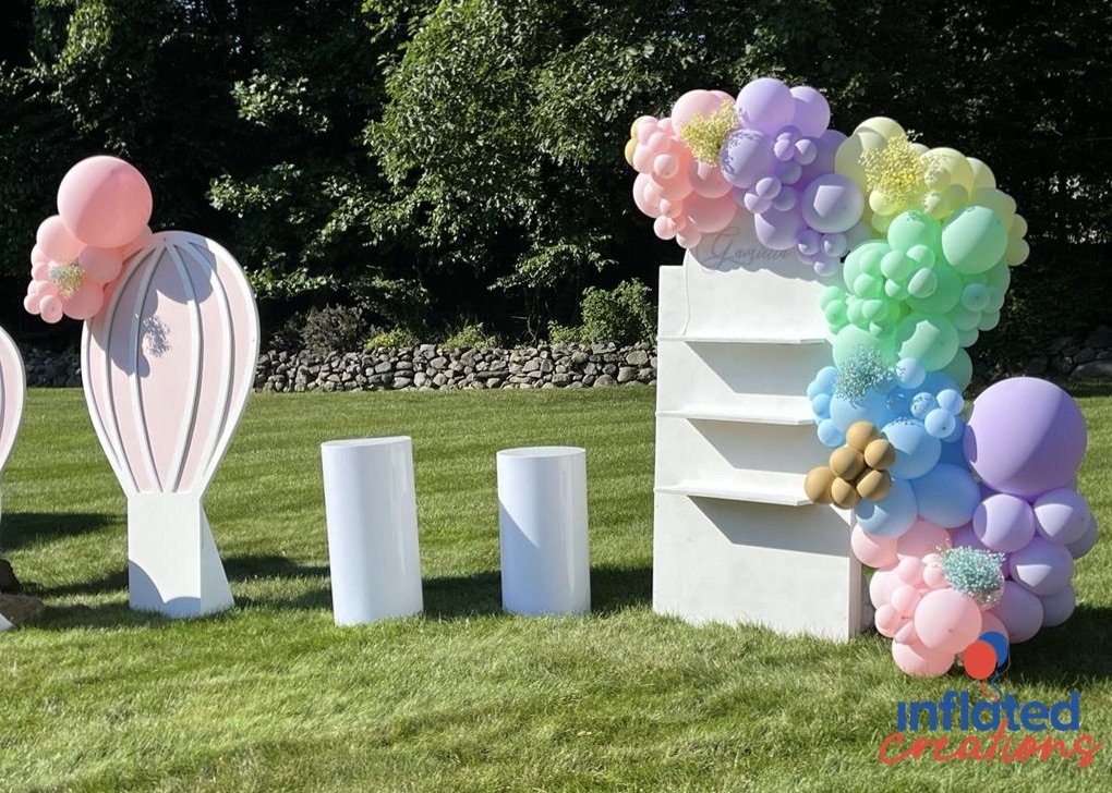 pastel decor organic balloon garland outdoor yard party with flowers