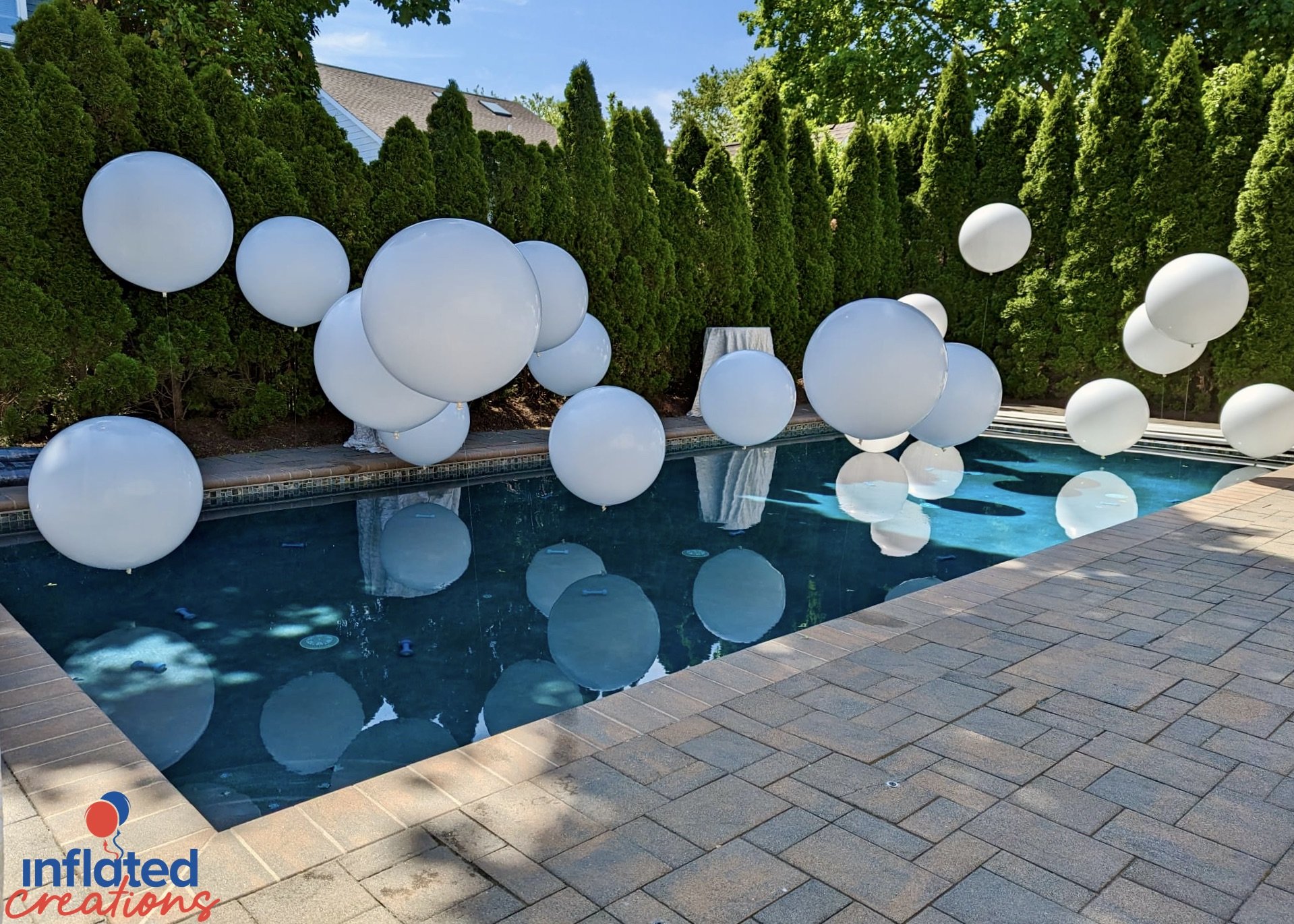 Engagement party outdoor pool balloon decor elegant white floating big impact