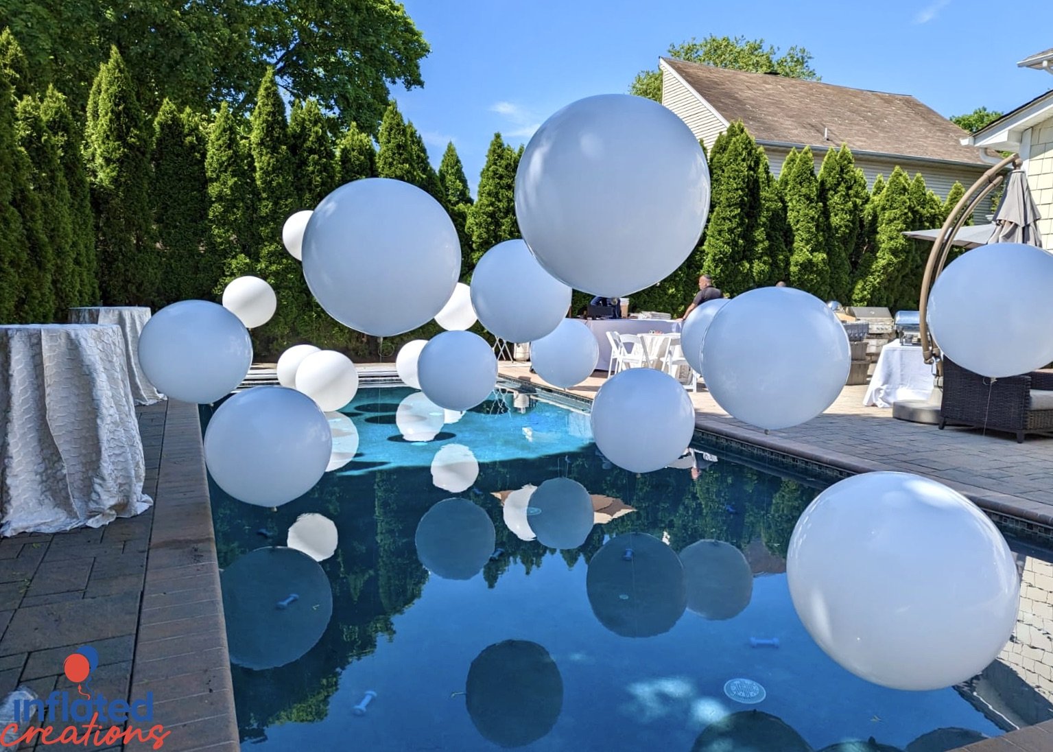 Engagement party outdoor pool balloon decor elegant white floating big impact