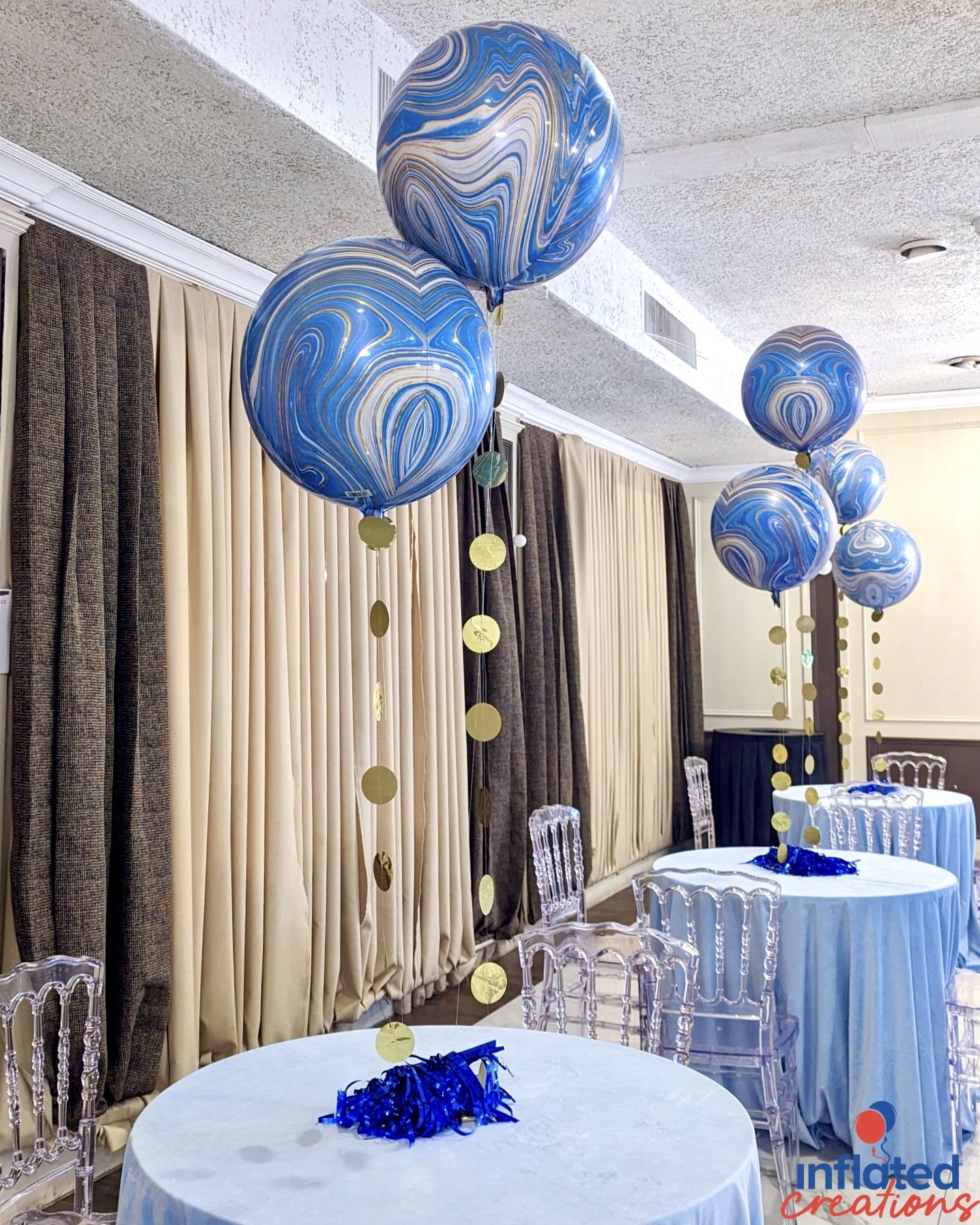 blue, white, gold tie-dye foil balloons centerpiece tassels and medallion coins
