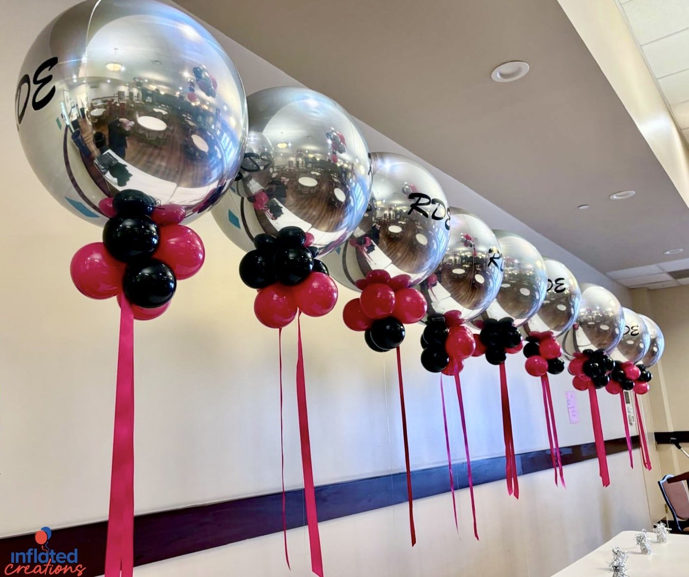 chrome balloons in a row.jpeg